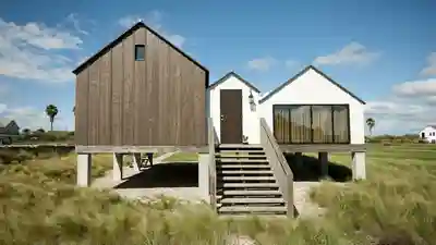 Coastal Florida house raised high on concrete pilings above a sandy lot
