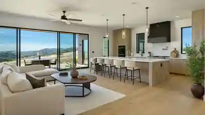 Interior of a professionally staged new-construction model home with an open-plan kitchen and living area