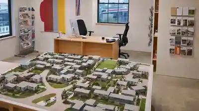Builder sales office with a large scale model of a residential community on a table
