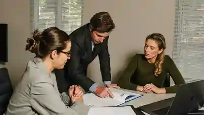 Real estate agent explaining a document to two attentive buyers in a bright office